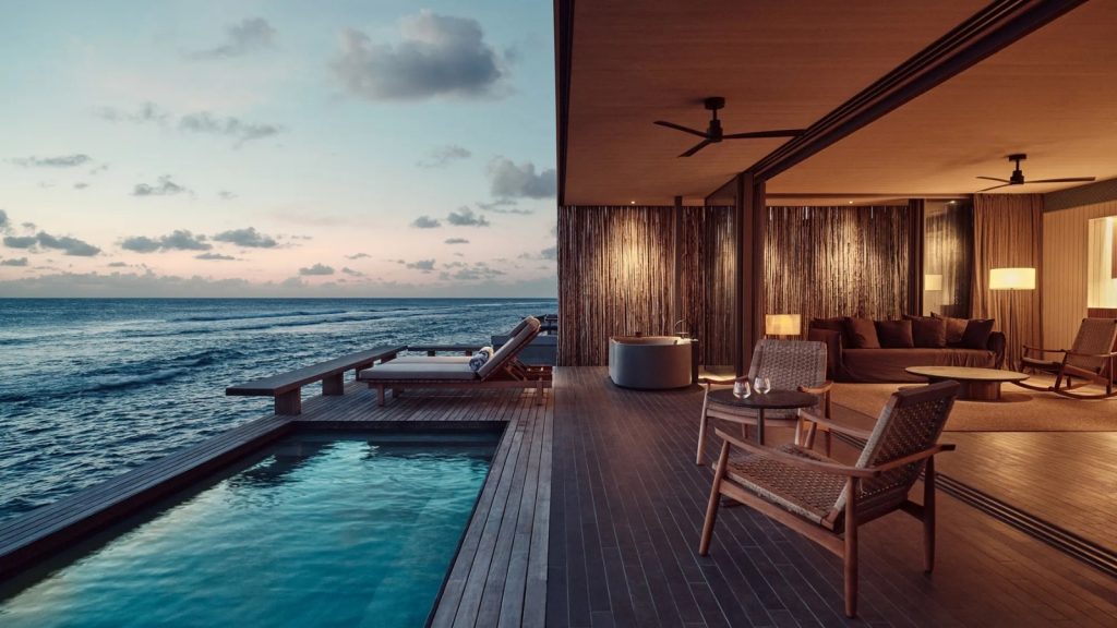 Luxury hotel room with balcony view overlooking the ocean